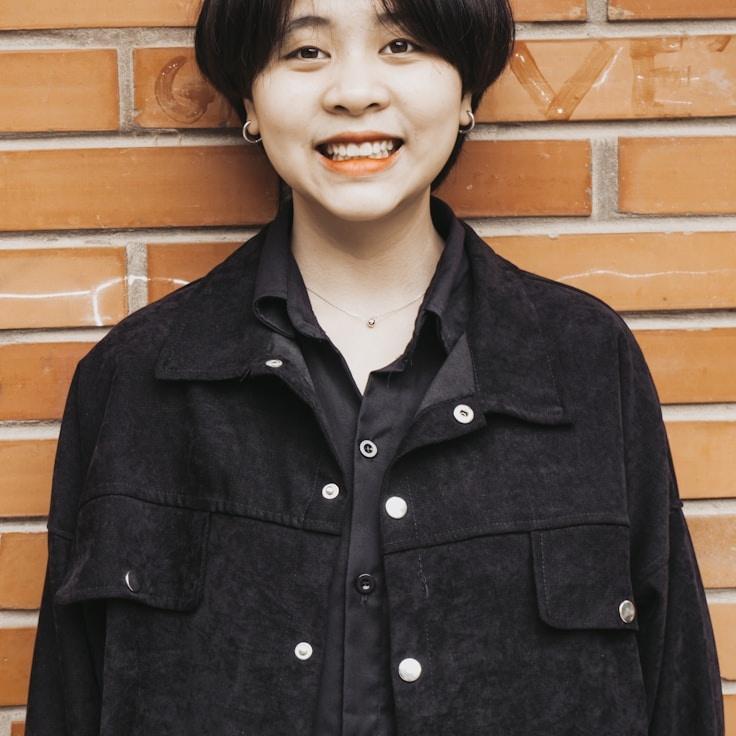 Avery Singh, Lead Design Curator at Questar Cade Voyage, reviewing corporate floral arrangements